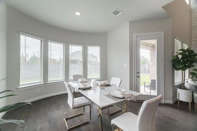 a view of a dining room with furniture window and outside view