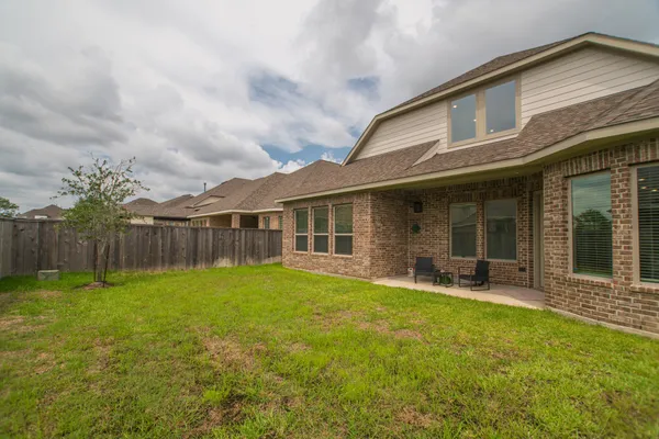 a front view of house with yard and seating space