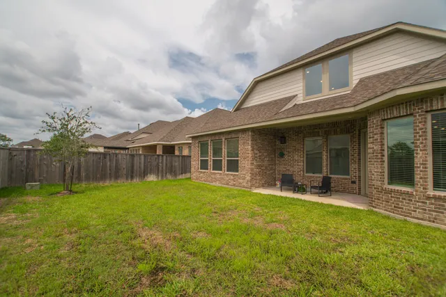 a front view of house with yard and seating space