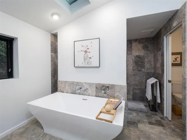 a bath tub sitting next to a bathroom