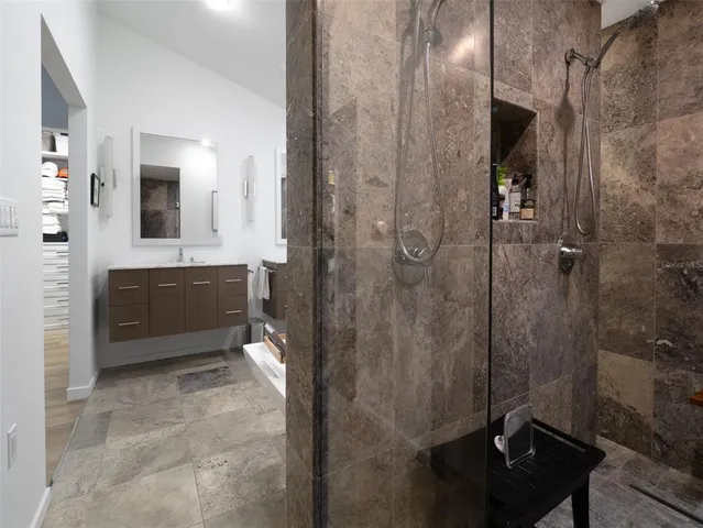 a bathroom with a sink and mirror