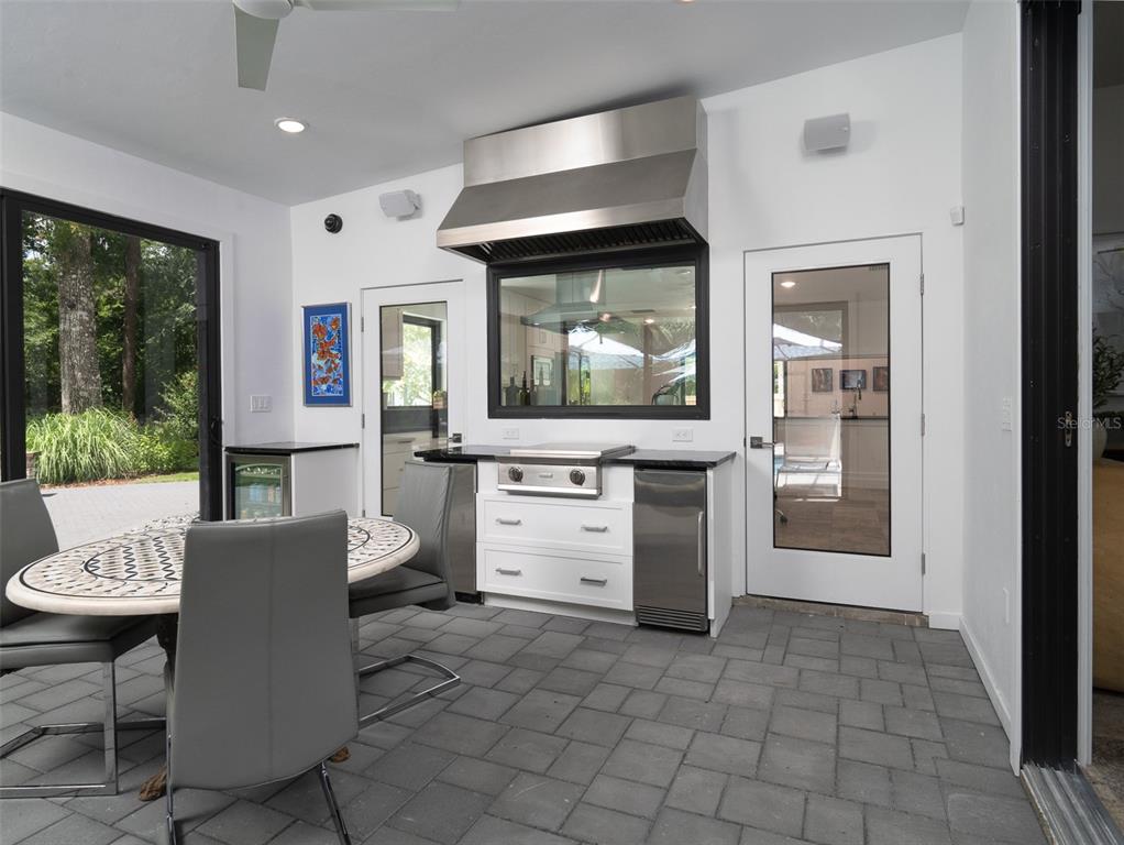 2416 Northwest 22 Drive Gainesville, FL 32605 - Photo 22 of 35 a living room with furniture and a large window