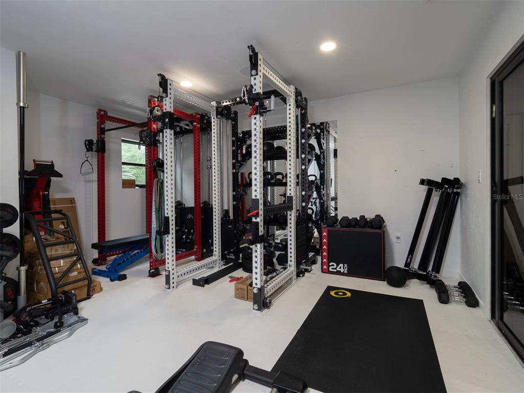 2416 Northwest 22 Drive Gainesville, FL 32605 - Photo 23 of 35 a view of a room with gym equipment