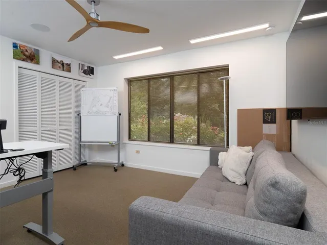 a living room with furniture and window