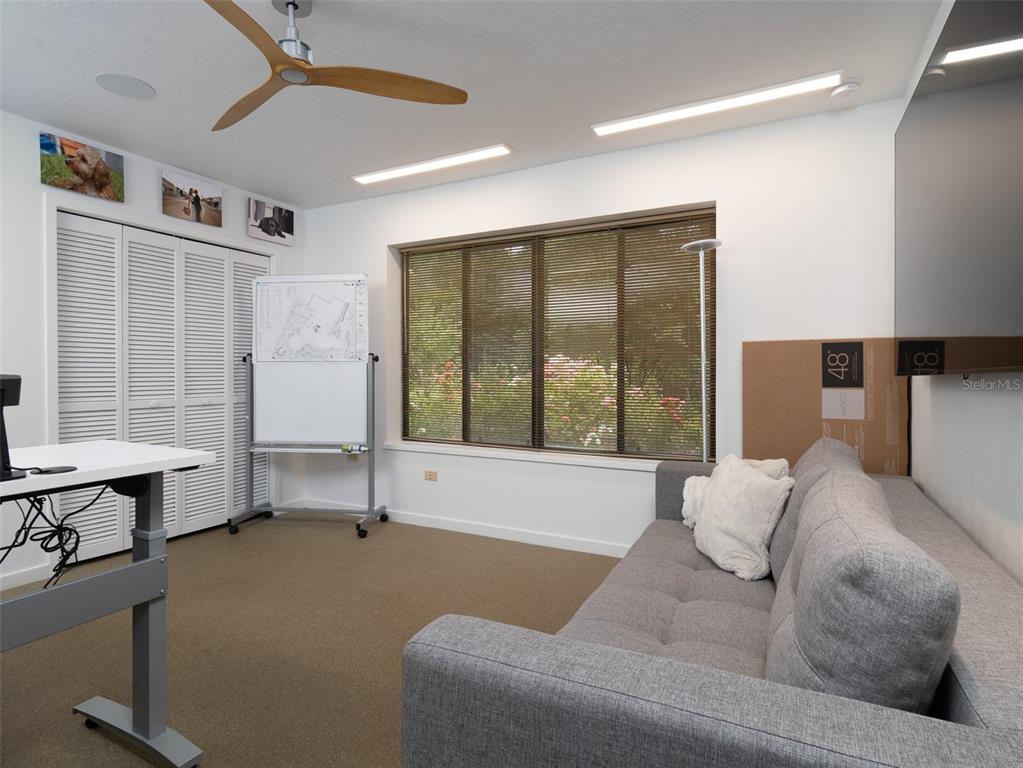 2416 Northwest 22 Drive Gainesville, FL 32605 - Photo 27 of 35 a living room with furniture and window