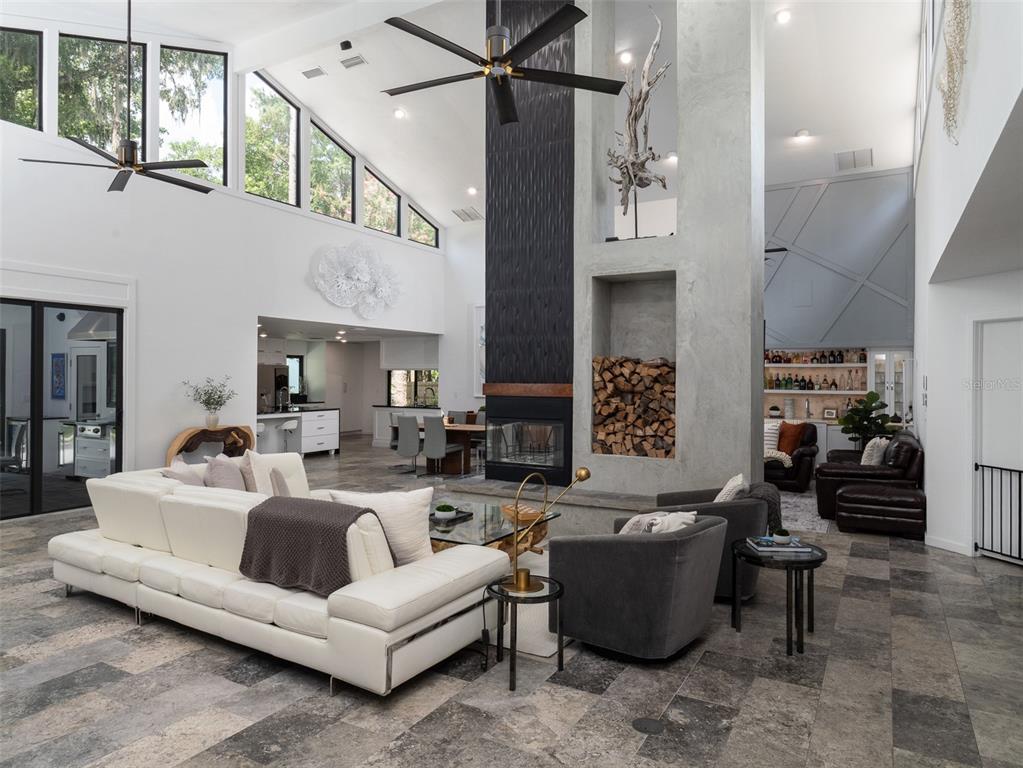 2416 Northwest 22 Drive Gainesville, FL 32605 - Photo 3 of 35 a living room with furniture and a fireplace