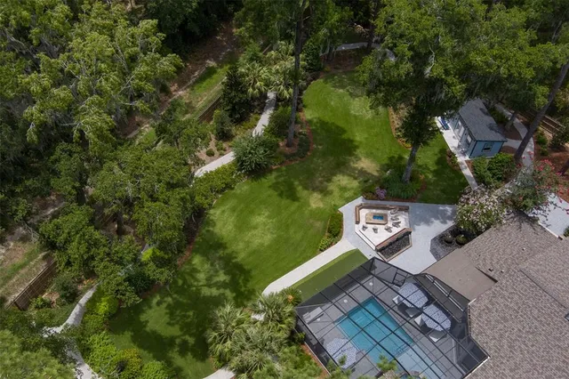 an aerial view of a house with yard