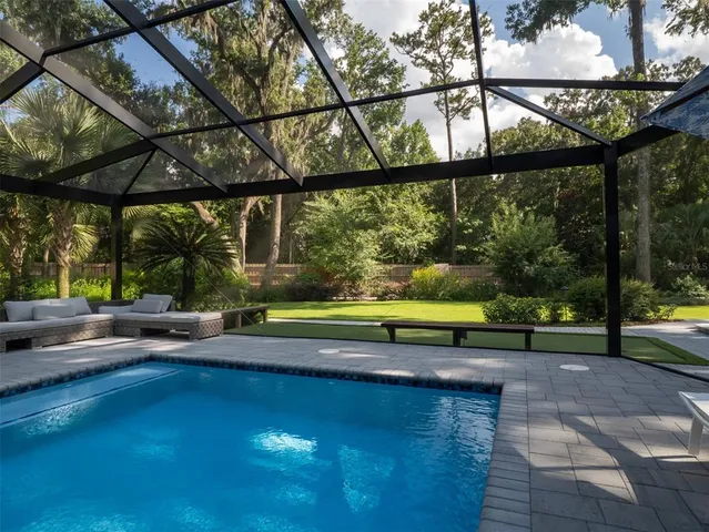 a view of swimming pool with a yard