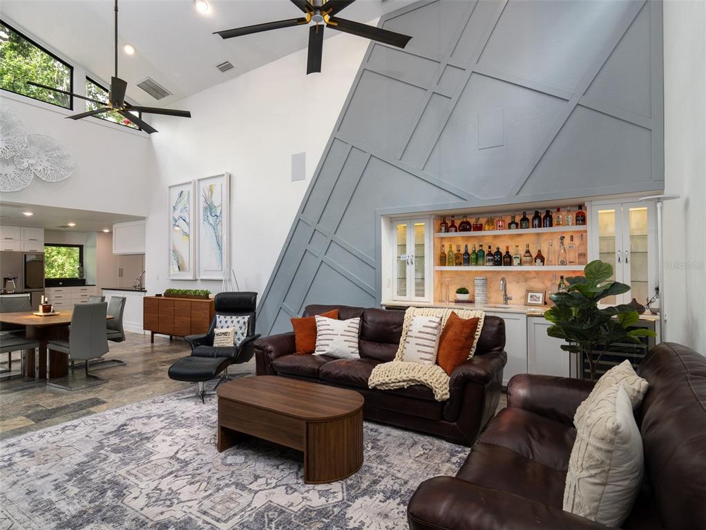 2416 Northwest 22 Drive Gainesville, FL 32605 - Photo 7 of 35 a living room with furniture and wooden floor
