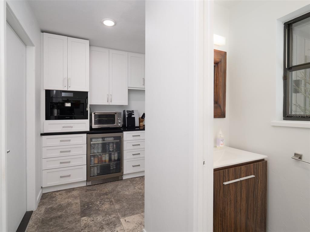 2416 Northwest 22 Drive Gainesville, FL 32605 - Photo 9 of 35 a kitchen with stainless steel appliances a stove and microwave