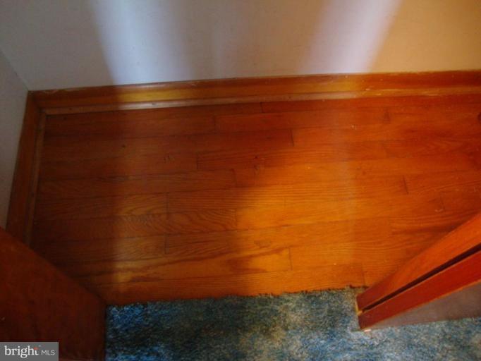 8417 Grove Road Ellicott City, MD 21043 - Photo 9 of 10 Hardwoods Underneath Carpet