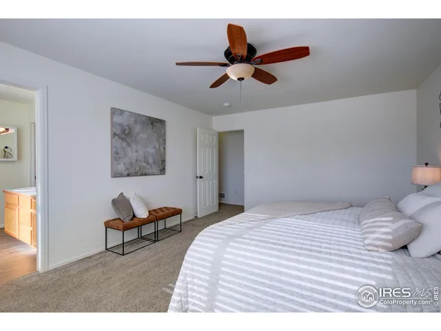 a bathroom with a granite countertop sink a mirror and vanity