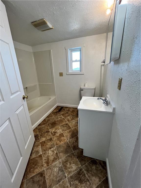 311 Lowell Street Vandergrift, PA 15690 - Photo 14 of 21 a bathroom with a sink a toilet and shower