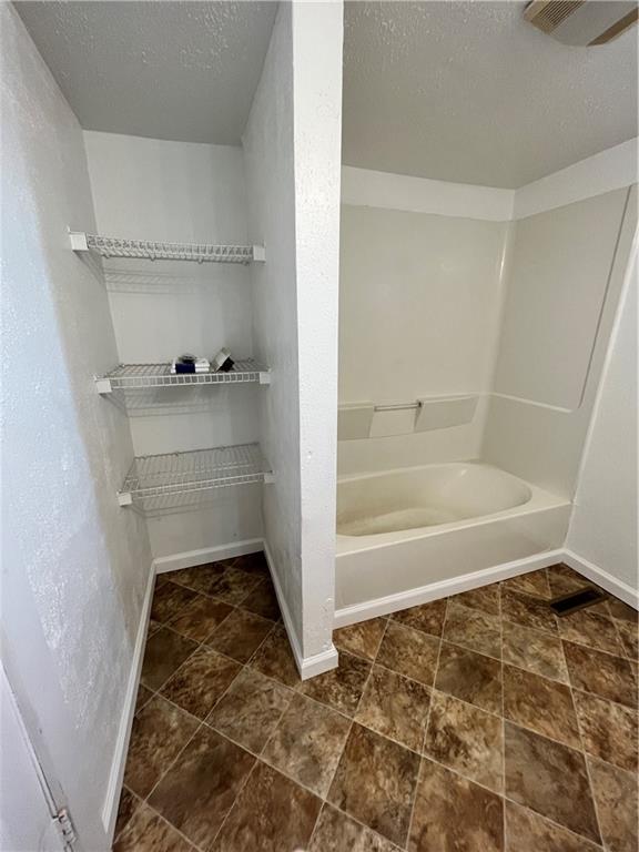 311 Lowell Street Vandergrift, PA 15690 - Photo 15 of 21 a bathroom with a bathtub and a shower