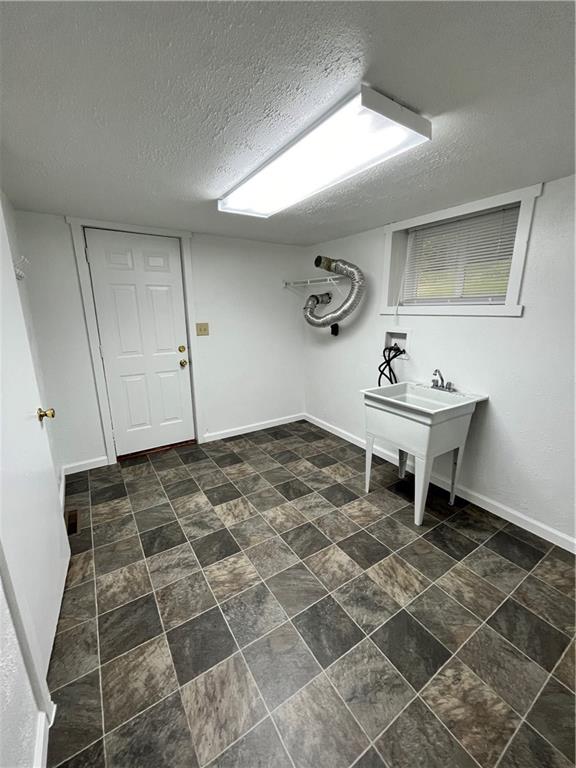 311 Lowell Street Vandergrift, PA 15690 - Photo 17 of 21 a living room with a sink and a mirror