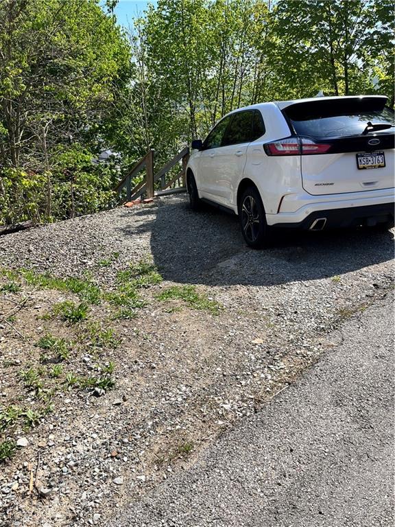 311 Lowell Street Vandergrift, PA 15690 - Photo 21 of 21 a view of a car in a yard