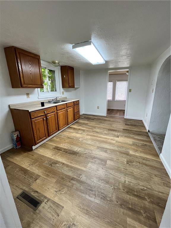 311 Lowell Street Vandergrift, PA 15690 - Photo 4 of 21 a large bedroom with a bed and flat screen tv