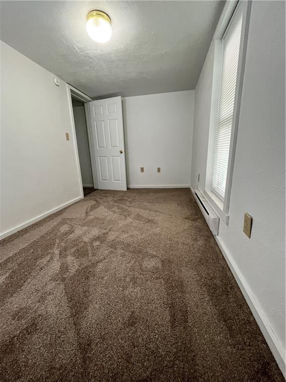 311 Lowell Street Vandergrift, PA 15690 - Photo 10 of 21 a view of a livingroom with an empty space and a window