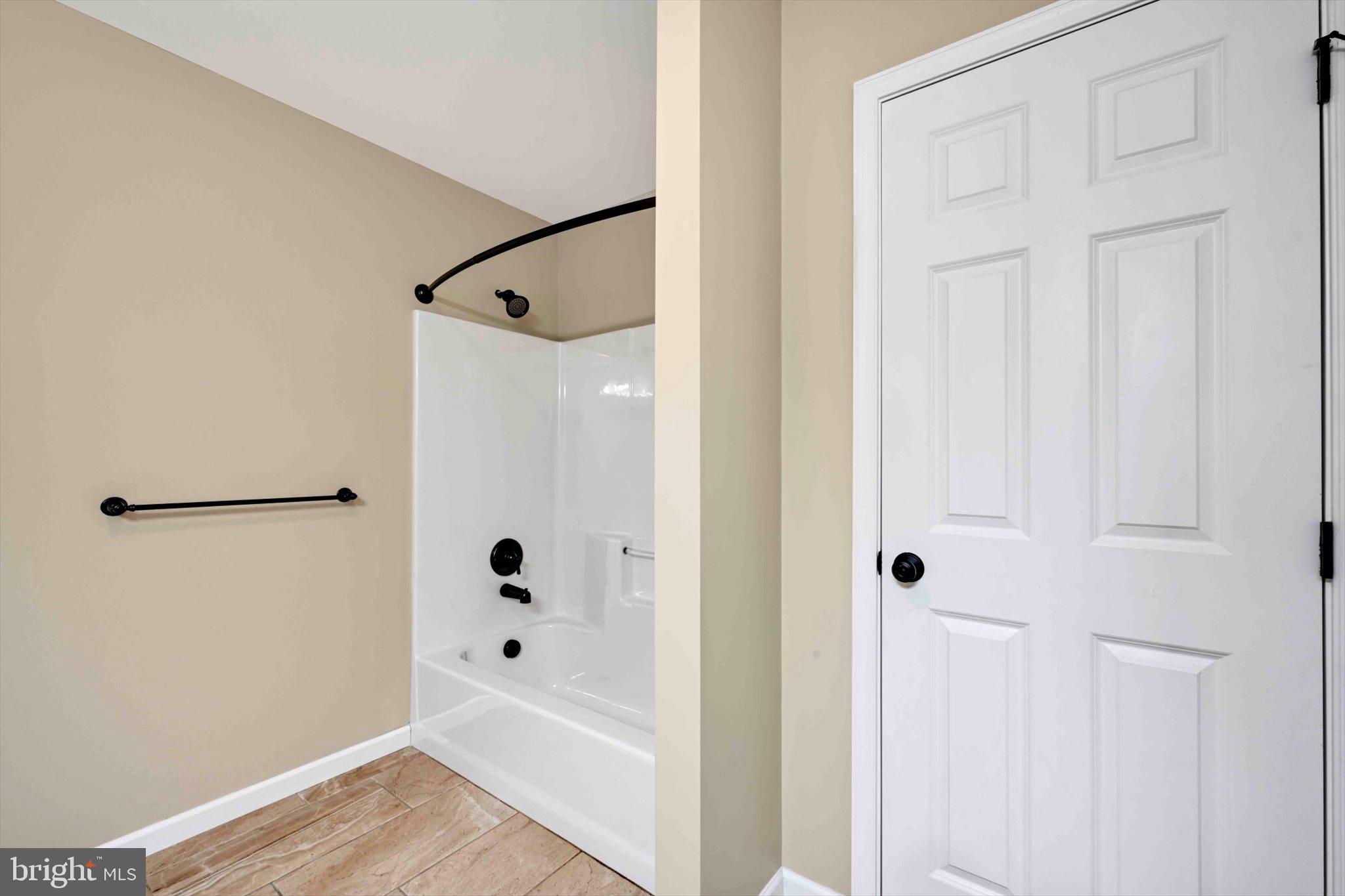 628 Warminster Lane Lititz, PA 17543 - Photo 30 of 50 a bathroom with a glass shower door