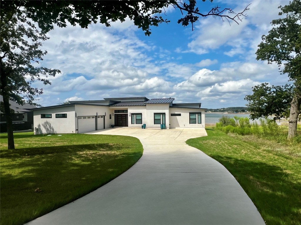 125 Peninsula Drive Burnet, TX 78611 - Photo 1 of 1 a front view of a house with a yard