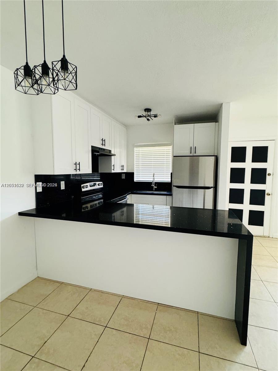 1755 Northeast 116th Road, Unit 17 North Miami, FL 33181 - Photo 1 of 19