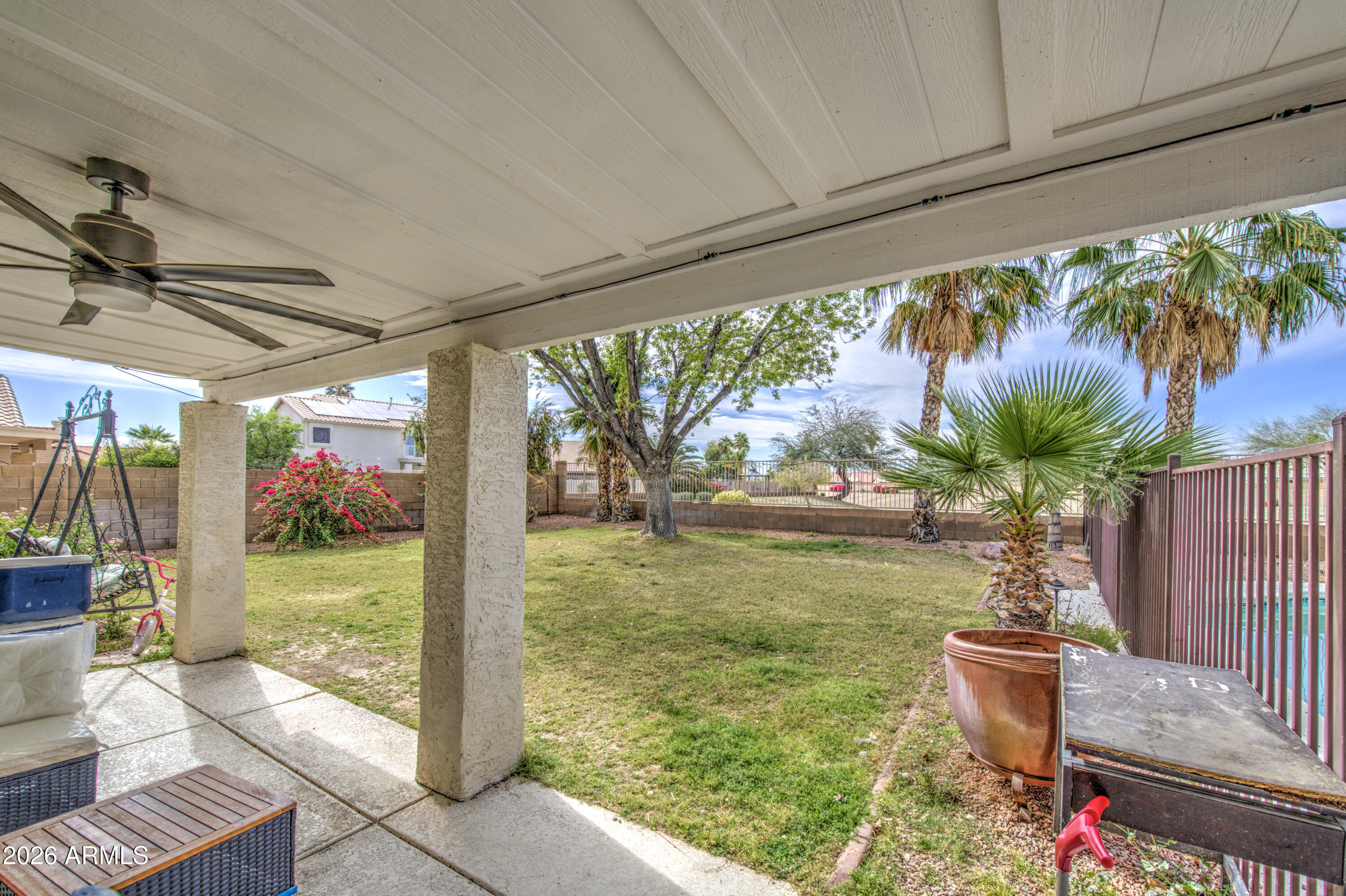 12403 West Monte Vista Road Avondale, AZ 85392 - Photo 56 of 63 a view of a porch with furniture and a yard