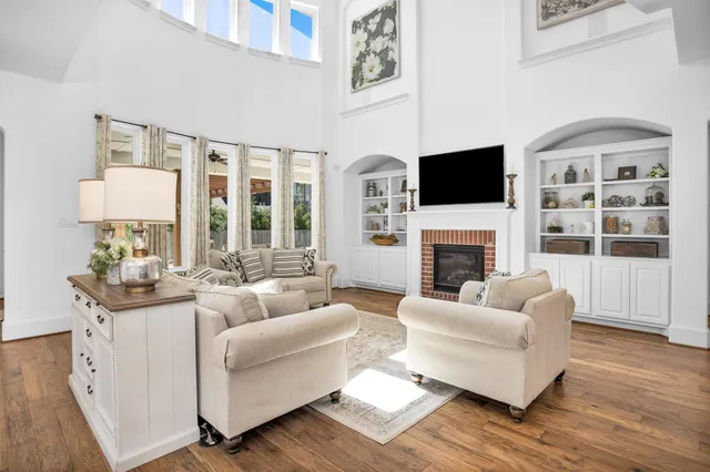 a living room with furniture fireplace and a flat screen tv