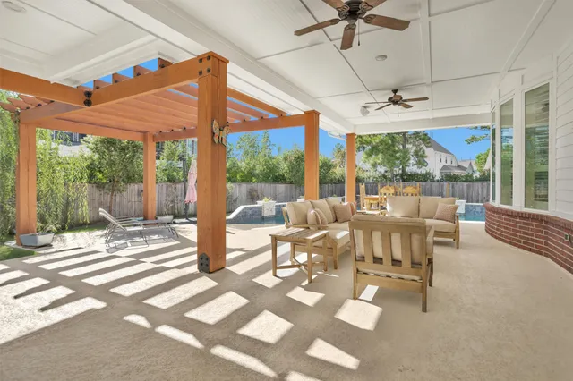 a outdoor space with the couches and dining table with the garden view