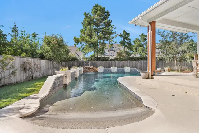 a view of a swimming pool with a patio
