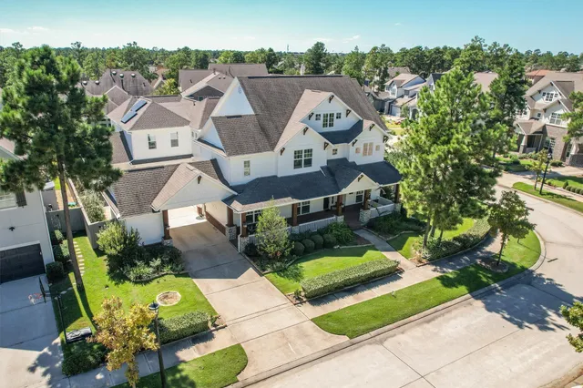 an aerial view of residential house with outdoor space and swimming pool