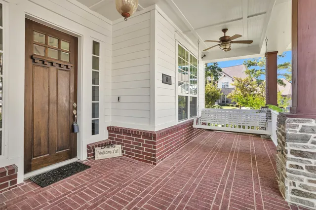 a view of a balcony with wooden floor