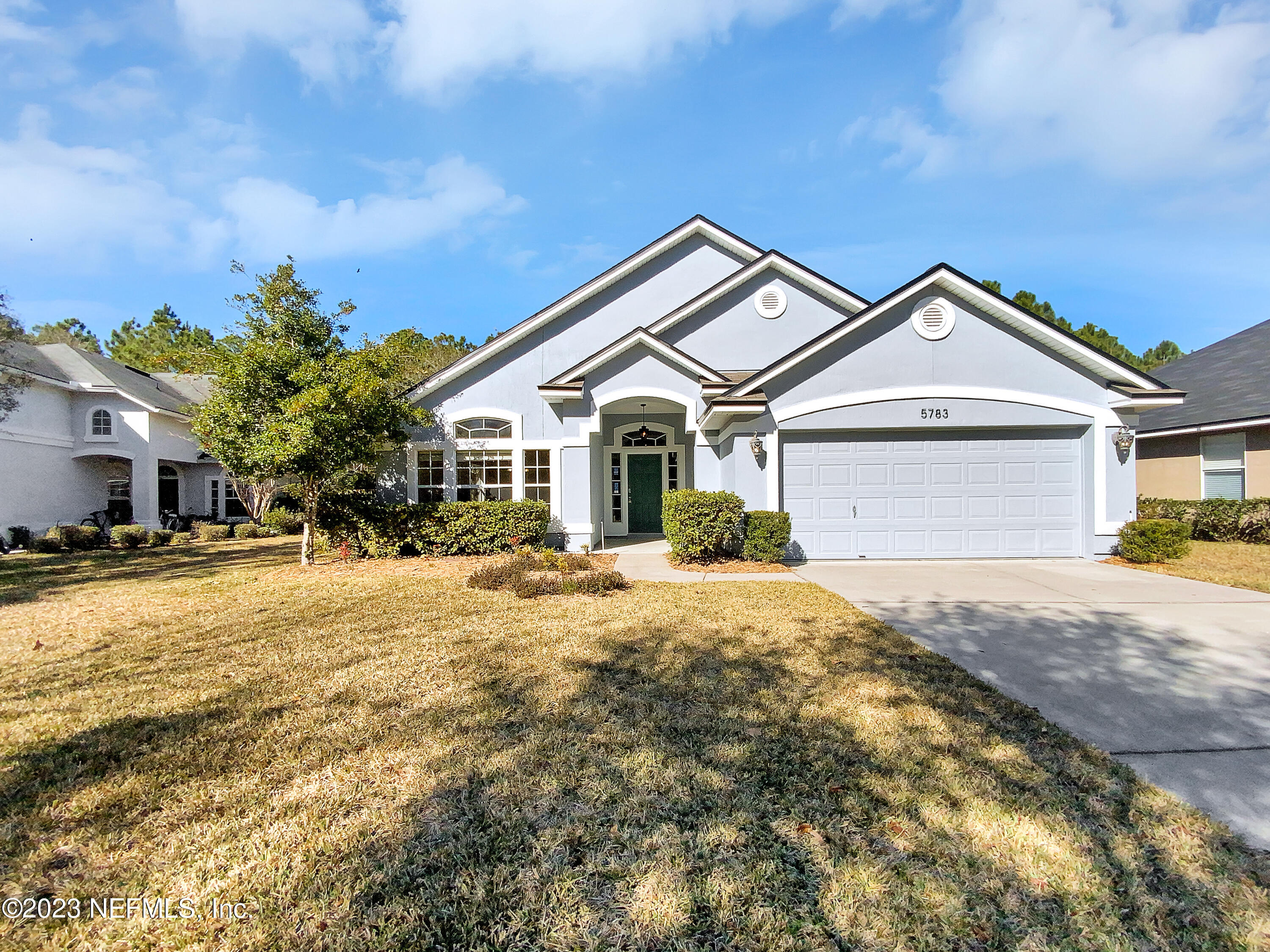 5783 Brush Hollow Road Jacksonville, FL 32258 - Photo 18 of 19 a front view of a house with a yard and garage