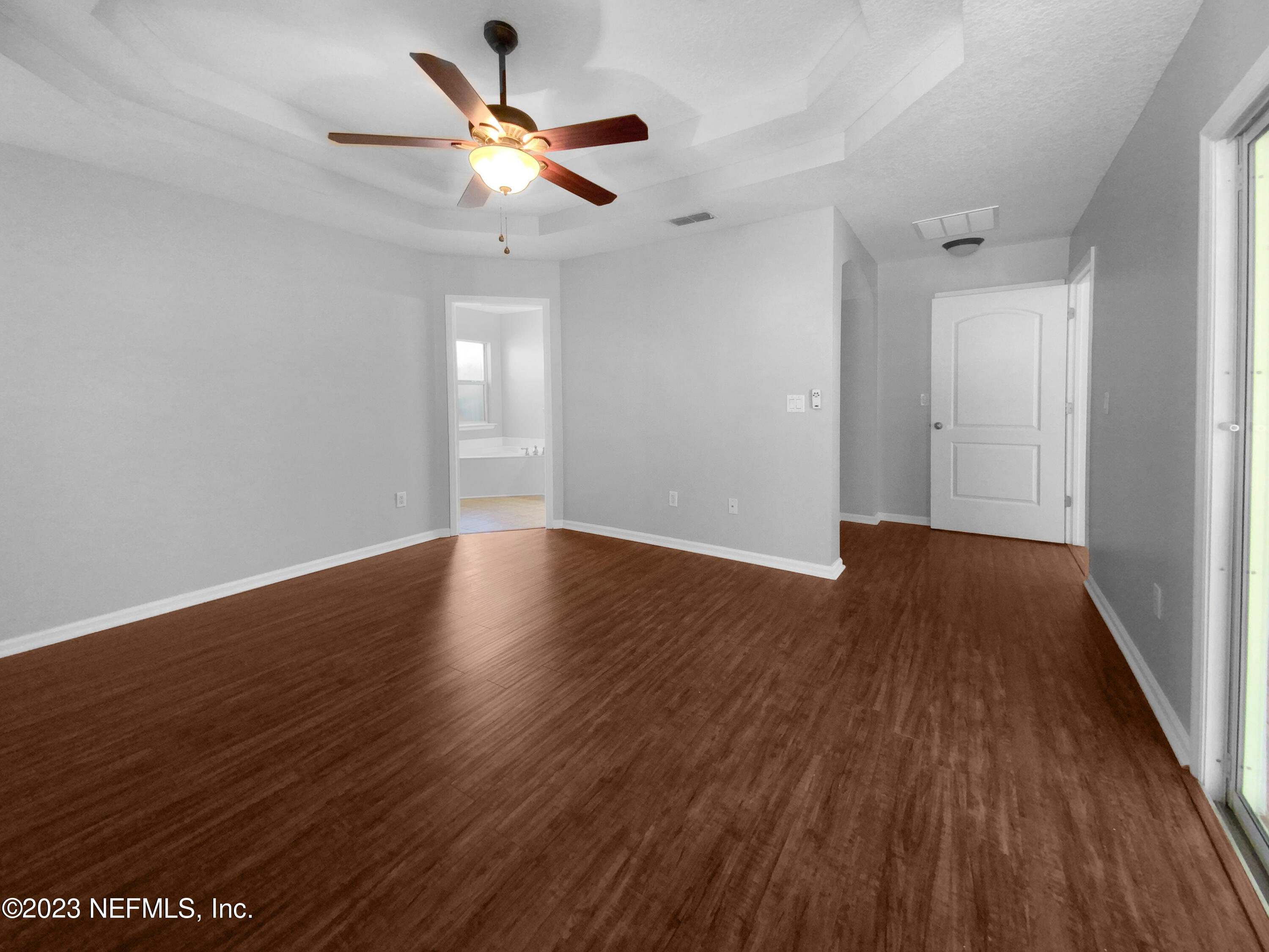 5783 Brush Hollow Road Jacksonville, FL 32258 - Photo 9 of 19 a view of an empty room with wooden floor