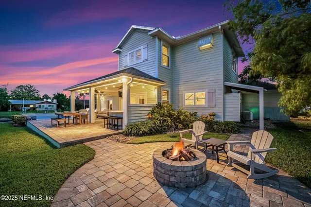 a view of house with backyard