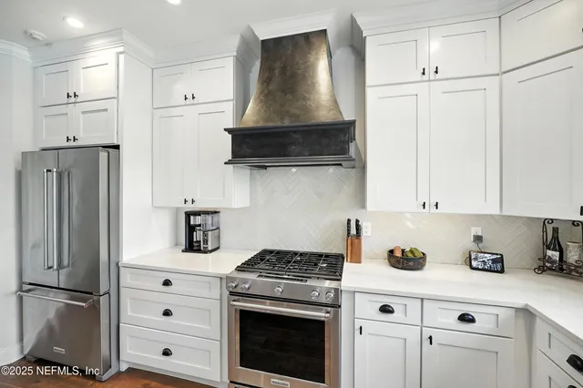 a view of an entryway with wooden floor and a chandelier