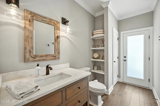 a spacious bathroom with a granite countertop sink mirror and double