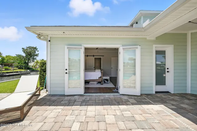 a view of a room with furniture and wooden floor