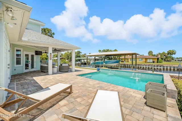 a view of a lake with houses in the back