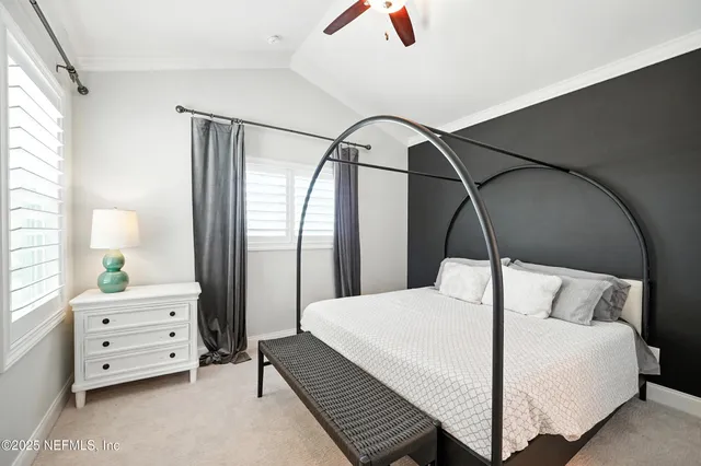 a utility room with a bed and a chair