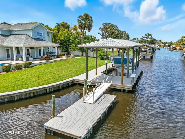 an aerial view of a house with a swimming pool