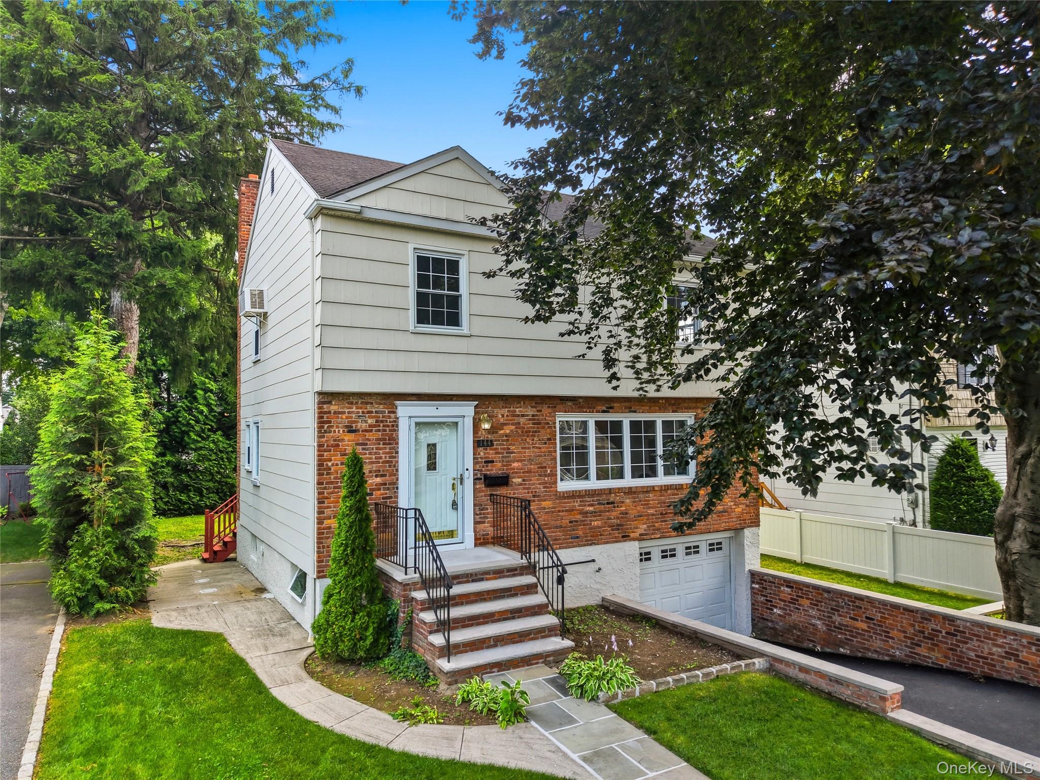 144 Bell Road Scarsdale, NY 10583 - Photo 2 of 49 Two-story residence featuring a brick and siding facade