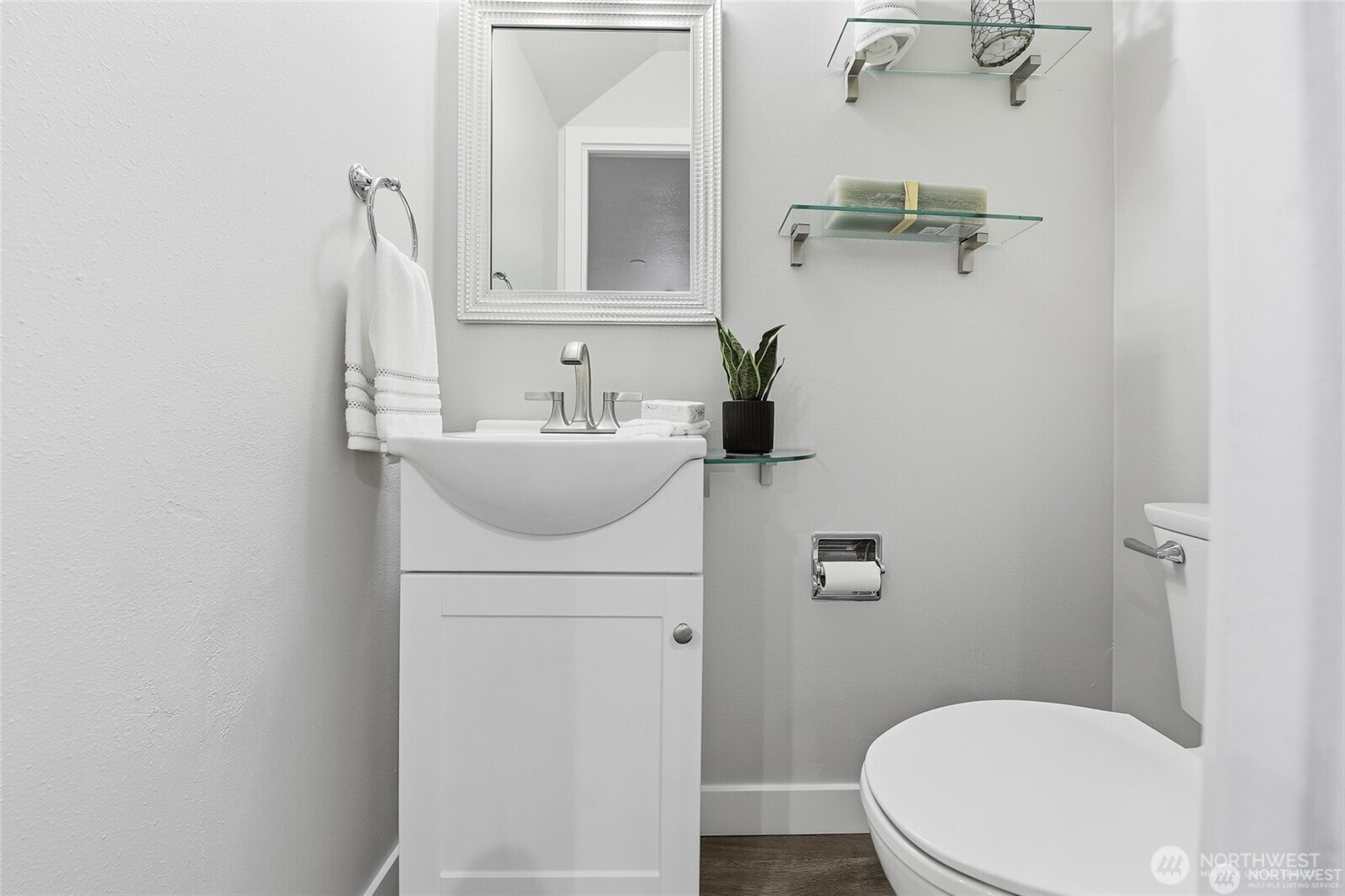 1940 North Northgate Way Seattle, WA 98133 - Photo 12 of 22 a bathroom with a sink a toilet and mirror