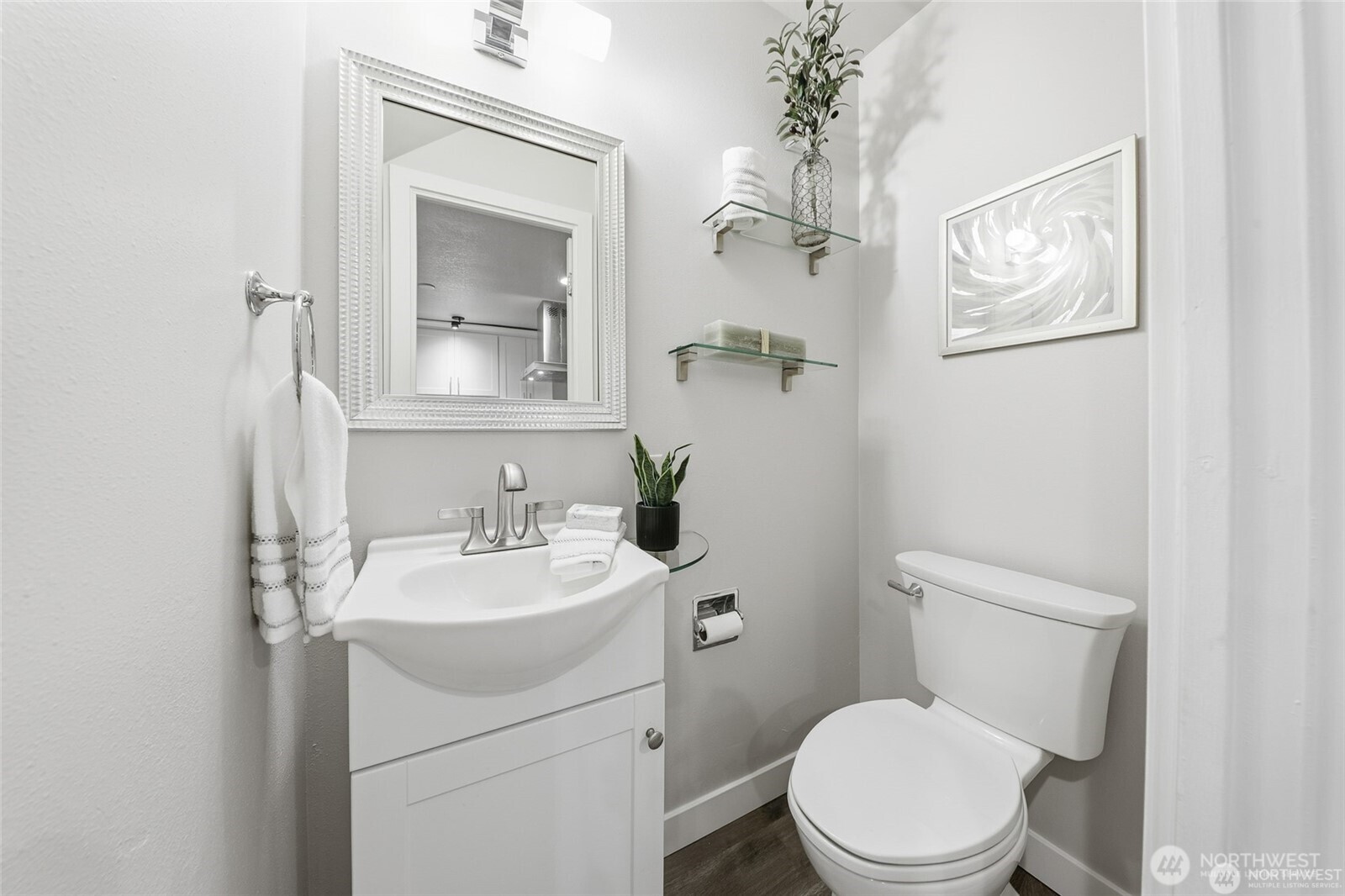 1940 North Northgate Way Seattle, WA 98133 - Photo 13 of 22 a bathroom with a toilet a sink and mirror