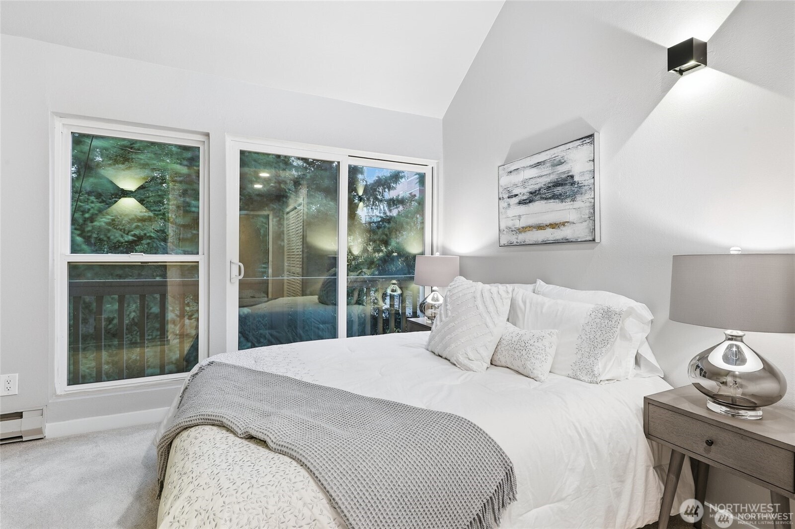 1940 North Northgate Way Seattle, WA 98133 - Photo 14 of 22 a bedroom with a bed and glass window