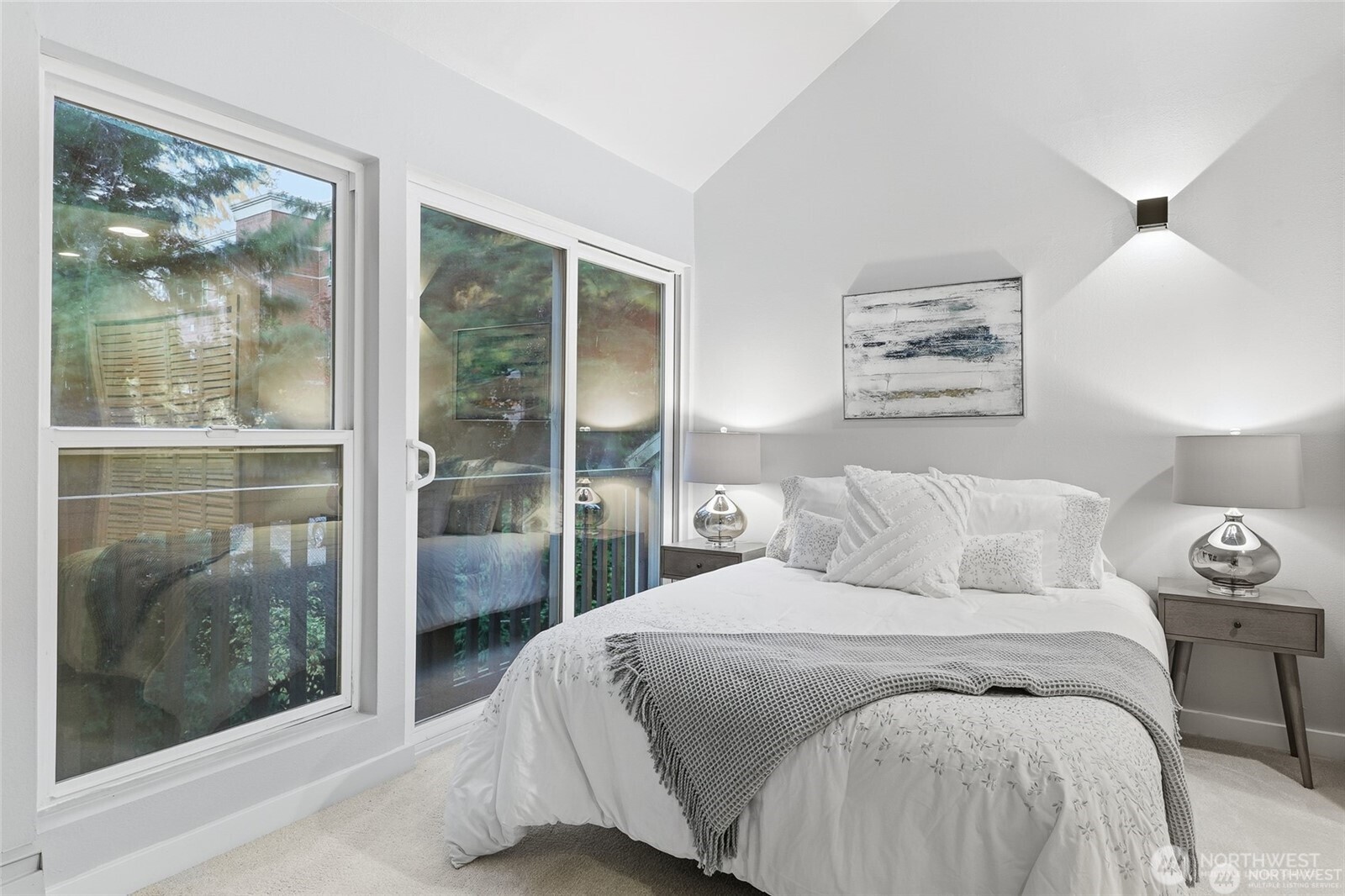 1940 North Northgate Way Seattle, WA 98133 - Photo 15 of 22 a bedroom with a bed and a painting on the wall