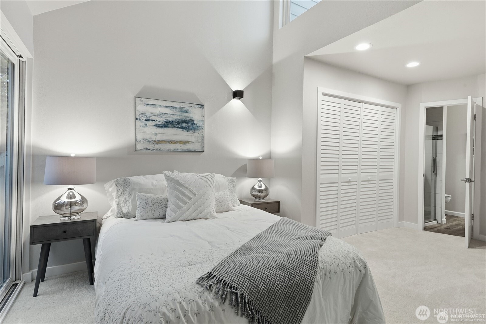 1940 North Northgate Way Seattle, WA 98133 - Photo 16 of 22 a bedroom with a bed and a lamp