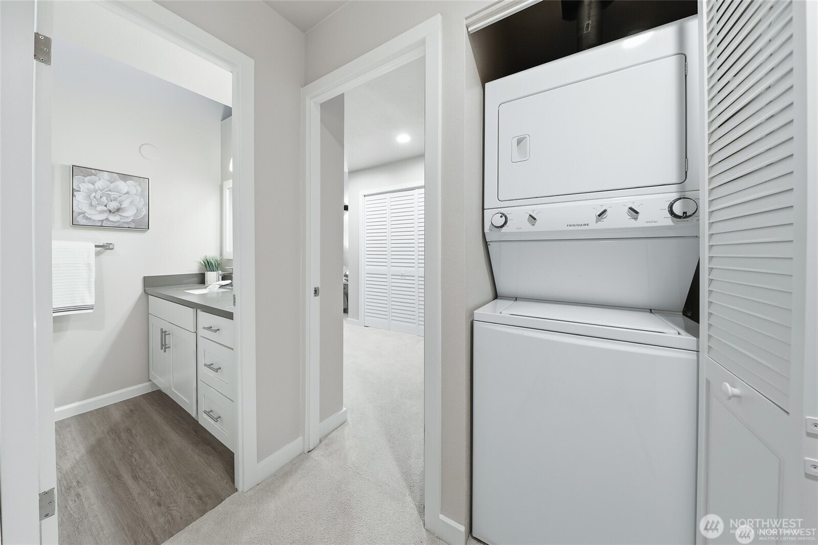 1940 North Northgate Way Seattle, WA 98133 - Photo 18 of 22 a view of washer and dryer with bathroom in the background