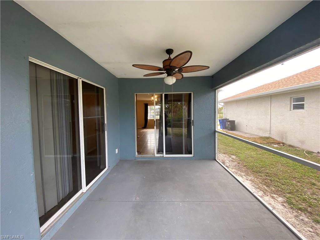 7319 Albany Road Fort Myers, FL 33967 - Photo 22 of 27 a view of a house with a ceiling fan and a large window