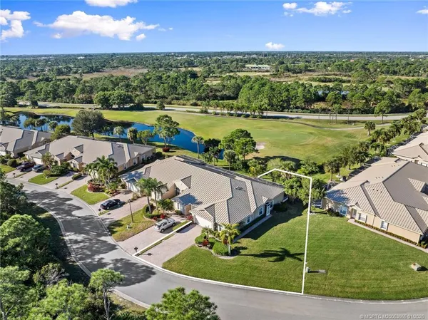 an aerial view of a house with a lake view