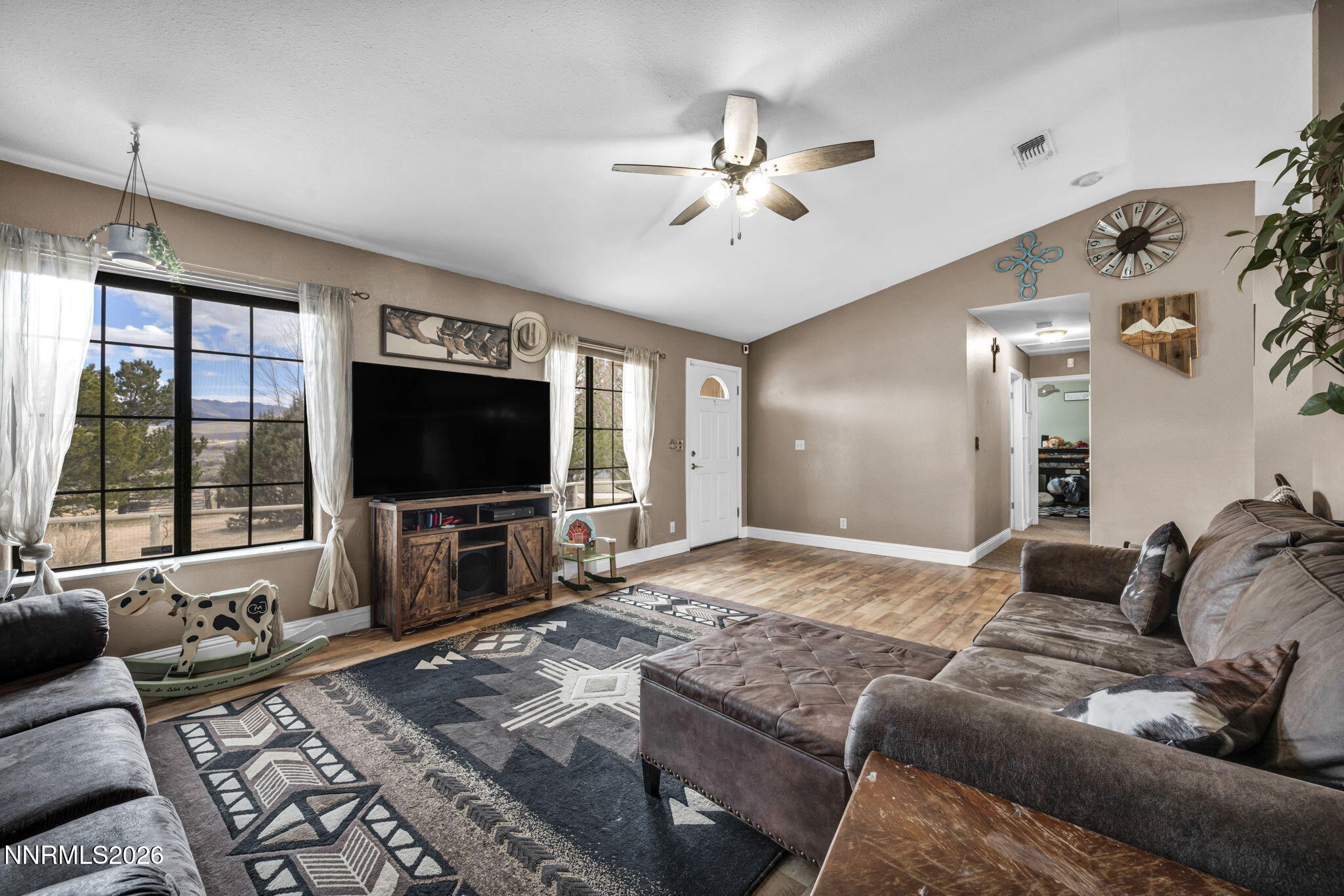 55 Buckboard Circle Reno, NV 89508 - Photo 4 of 39 a living room with furniture and a flat screen tv